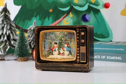 Felinar decorativ Craciun tip televizor retro cu scena fixa si efect de ninsoare, lumina calda, 25 cm