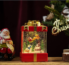 Felinar decorativ Craciun in forma de cadou, cu scena fixa si efect de ninsoare, lumina calda, 20 cm