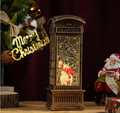 Felinar decorativ Craciun tip cabina telefonica, cu scena fixa si efect de ninsoare, lumina calda, 25 cm