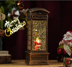 Felinar decorativ Craciun tip cabina telefonica, cu scena fixa si efect de ninsoare, lumina calda, 25 cm