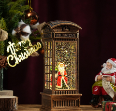 Felinar decorativ Craciun tip cabina telefonica, cu scena fixa si efect de ninsoare, lumina calda, 25 cm